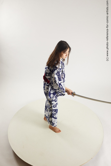 Woman Young Athletic Fighting with sword Asian Costumes