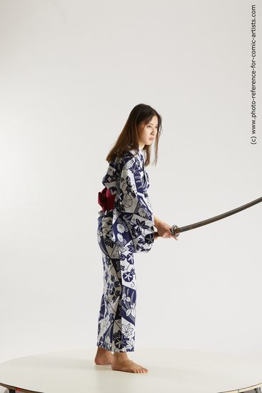 Woman Young Athletic Fighting with sword Asian Costumes