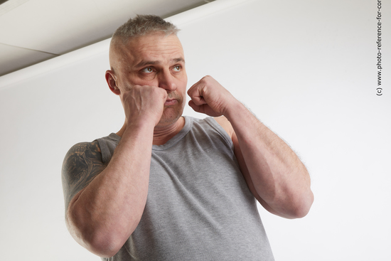 Man Adult Average White Fist fight Standing poses Casual