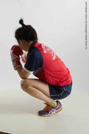 Woman Young Average Kneeling poses Sportswear Asian