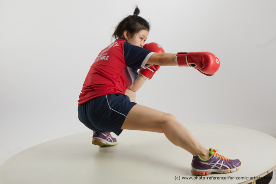 Woman Young Average Kneeling poses Sportswear Asian