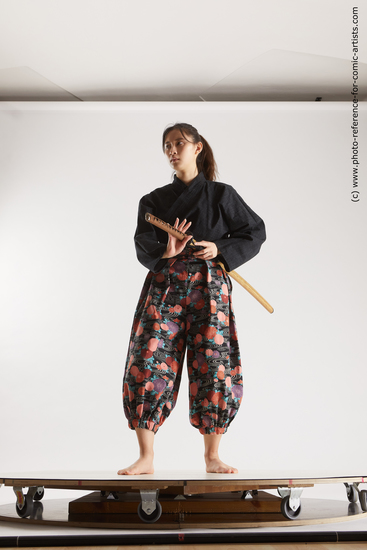 Woman Young Athletic Fighting with sword Standing poses Asian Costumes