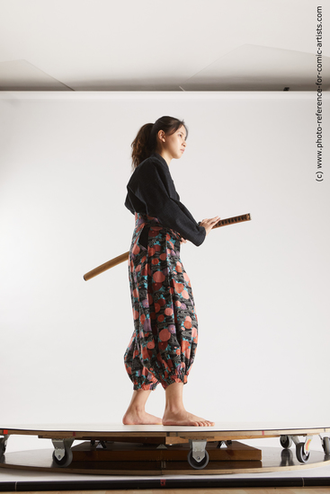 Woman Young Athletic Fighting with sword Standing poses Asian Costumes