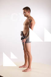 Man Adult Muscular White Fighting with gun Standing poses Underwear