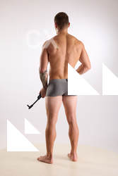 Man Adult Muscular White Fighting with gun Standing poses Underwear