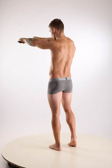 Man Adult Muscular White Fighting with gun Standing poses Underwear
