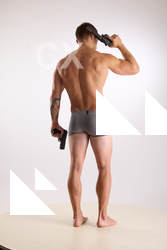 Man Adult Muscular White Fighting with gun Standing poses Underwear