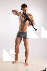 Man Adult Muscular White Fighting with rifle Standing poses Underwear