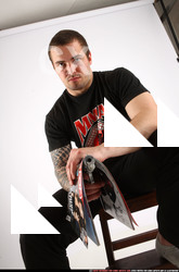 Man Adult Average White Fighting with gun Sitting poses Casual