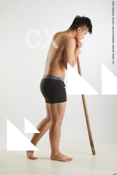 Yoshinaga Kuri Resting With Wooden Stick 07