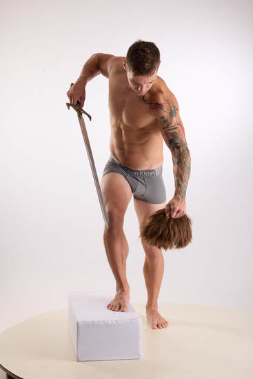 Man Adult Muscular White Fighting with sword Kneeling poses Underwear