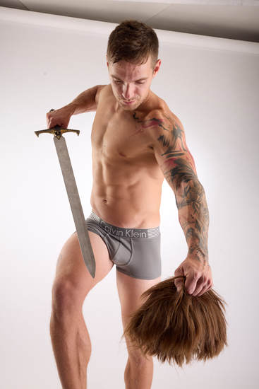 Man Adult Muscular White Fighting with sword Kneeling poses Underwear