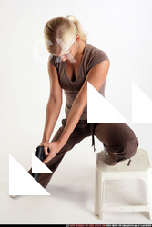 IVA KNEELING ON CHAIR SHOOTINGDOWN