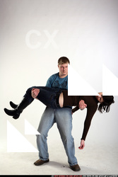 JANISONE CARRYING WOUNDED WOMAN