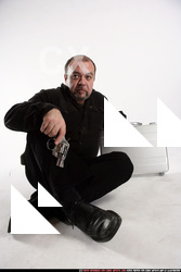 Matej-kneeling-suitcase