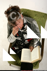 Paula-sitting-reading-happy