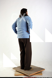 Beata-standing-arms-akimbo