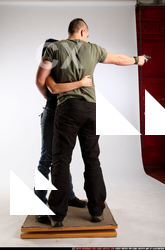 AIDEEN-STANDING-AIMING-GUNS