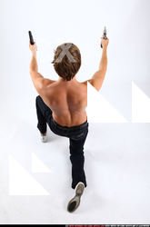 patrick-kneeling-dual-pistols