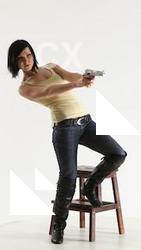 natalie-leaning-shooting-pistol