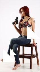 nina-sitting-pistol-pose4