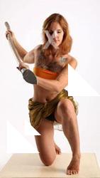 amy-prehistoric-kneeling-spear-attack