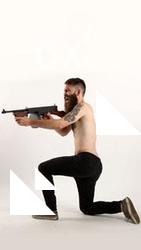 oscar-kneeling-tommygun-shooting