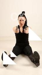 claudia-sitting-dual-pistols