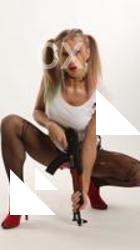 NIKOL SQUATTING POSE WITH GUN