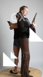 OXANA AND XENIA STANDING POSE WITH GUNS