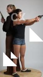 OXANA AND XENIA STANDING POSE WITH GUNS 4