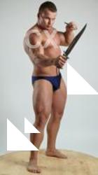 ADAM_WARD STANDING WITH TWO KNIVES