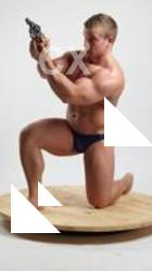 ADAM_WARD KNEELING WITH GUN