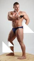 ADAM_WARD STANDING AIMING WITH GUN