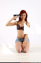 Nina Sitting Pose With Pistol Pose 