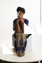 Dina Moses African Woman Sitting Pose