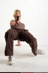 Woman Young Athletic White Fighting with gun Kneeling poses Sportswear