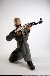 Woman Adult Athletic White Fighting with submachine gun Kneeling poses Army