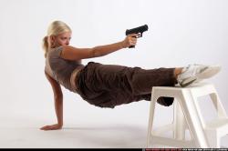 Woman Adult Athletic White Fighting with gun Moving poses Sportswear