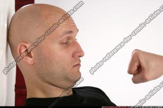 FIST IN FRONT OF FACE 00