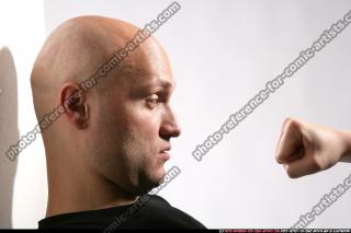 FIST IN FRONT OF FACE 07