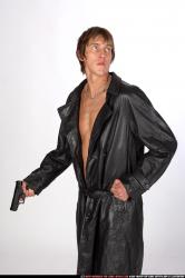 Man Young Athletic White Fighting with gun Standing poses Coat