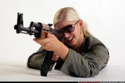 Woman Adult Athletic White Fighting with submachine gun Laying poses Army