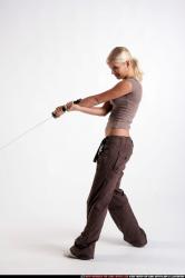 Woman Young Athletic White Fighting with sword Moving poses Sportswear