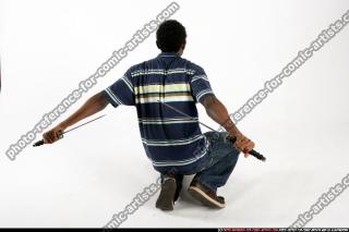 TEENAGER KNEELING DUAL KATANA 04.jpg