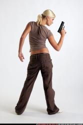 Woman Young Athletic White Fighting with gun Standing poses Sportswear