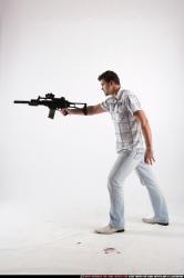 Man Adult Average White Fighting with submachine gun Standing poses Casual