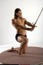 Man Adult Muscular White Fighting with sword Kneeling poses Underwear