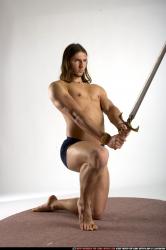 Man Adult Muscular White Fighting with sword Kneeling poses Underwear