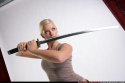 Woman Young Athletic White Fighting with sword Standing poses Sportswear